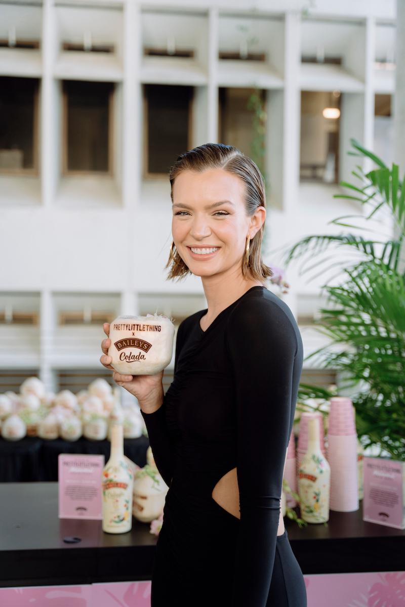 josephine skriver sipped on specialty baileys colada cocktails served in custom coconuts at the prettylittlething runway show during miami swim week