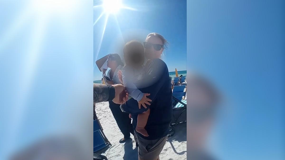 image of Concerned beachgoers called 911 after discovering the infant unattended.