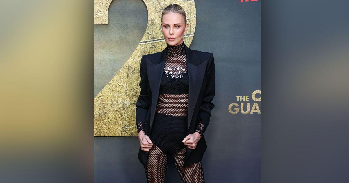 charlize theron sizzles fishnet tights hot pants old guard premiere photos