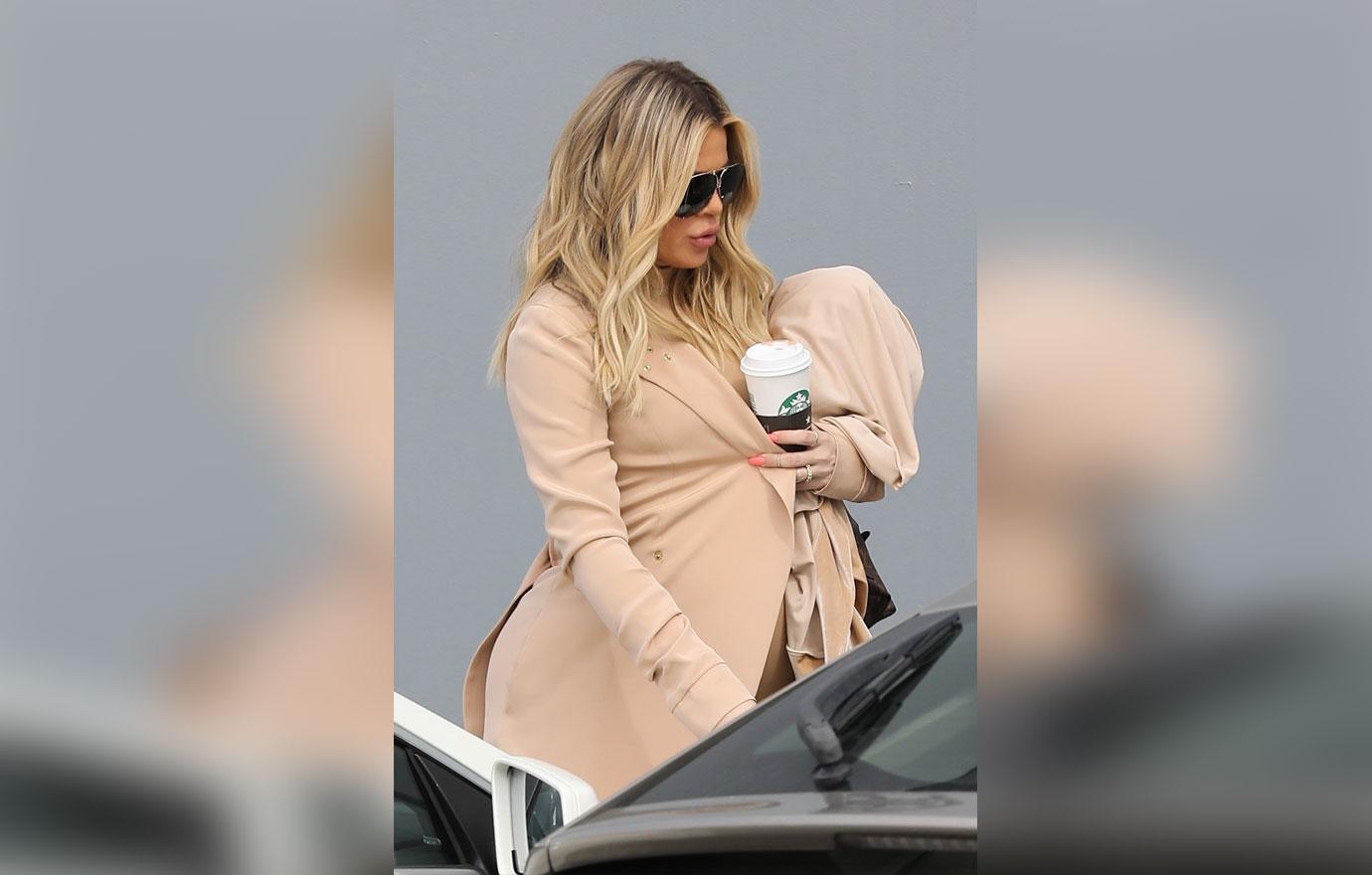 Khloe Kardashian covers up her bump at the Studio