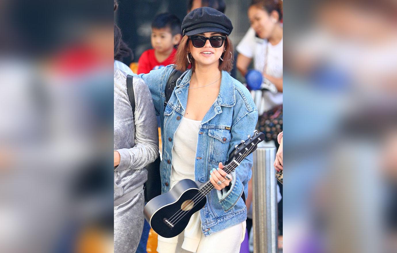 *EXCLUSIVE* Selena Gomez arrives at Sydney Airport carrying her Ukulele Guitar!