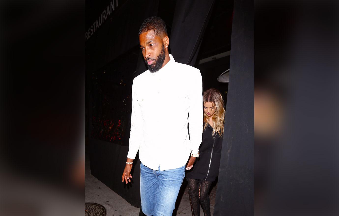 Khloe Kardashian and Tristan Thompson kiss during a dinner date in Beverly Hills