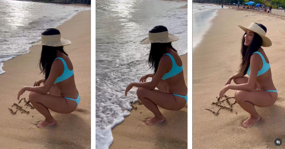 image of The singer marked the milestone by writing ‘48’ in the sand while enjoying time at her favorite beach.