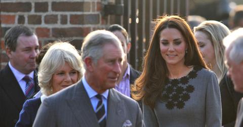 kate middleton king charles leaning each other