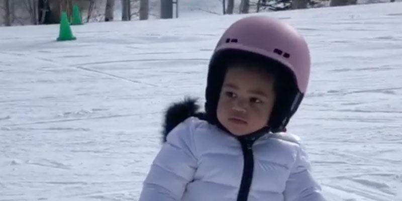 Stormi Snowboarding In Ski Clothes