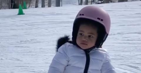 Stormi Snowboarding In Ski Clothes