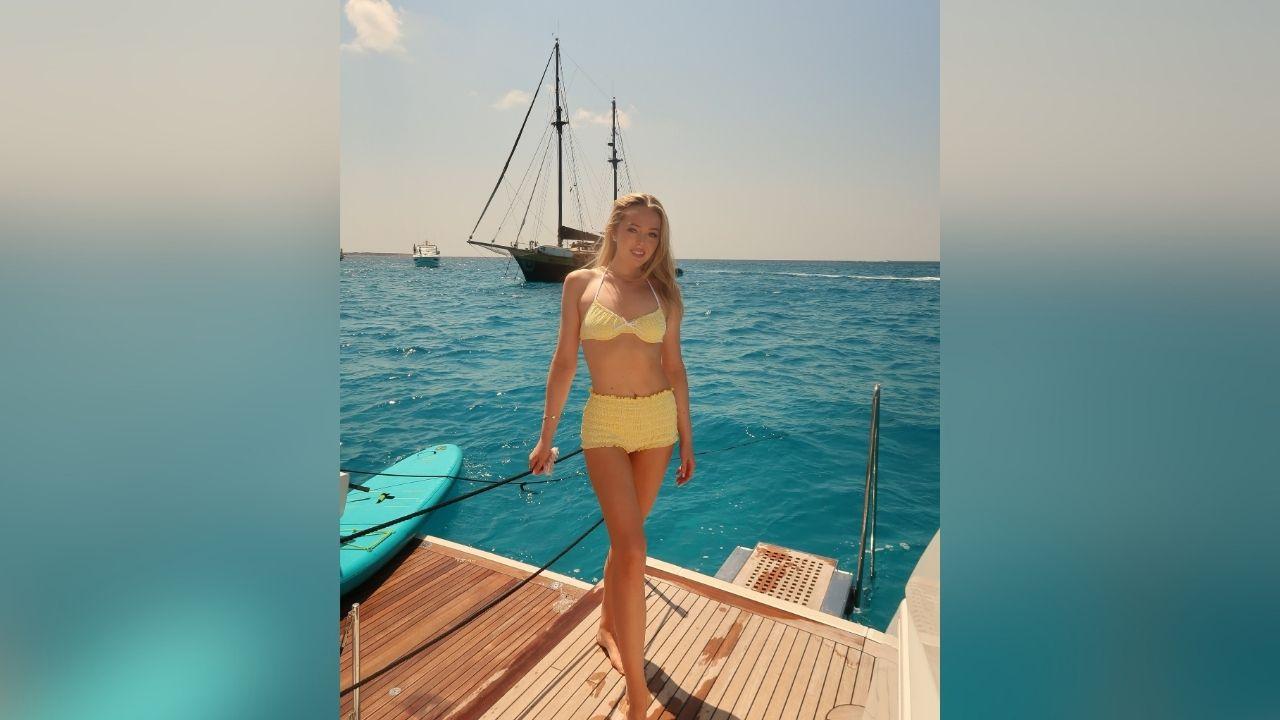 image of Tiffany Trump posed aboard a boat with Michael Boulos as they enjoyed the scenic seaside setting.