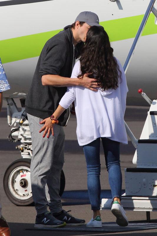 EXCLUSIVE: Ashton Kutcher and Mila Kunis were seen departing on private jet from Hawaii.