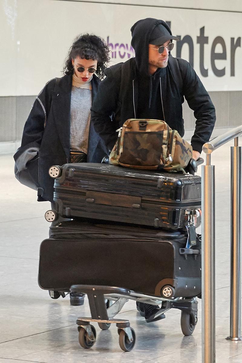 *EXCLUSIVE* Robert Pattinson and his fiance FKA Twigs arrive at Heathrow Airport **USA ONLY**