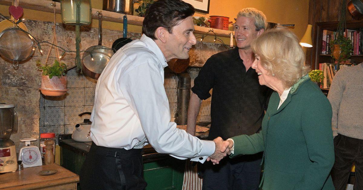 image of Queen Camilla shakes hands with 'Rivals' star David Tennant.