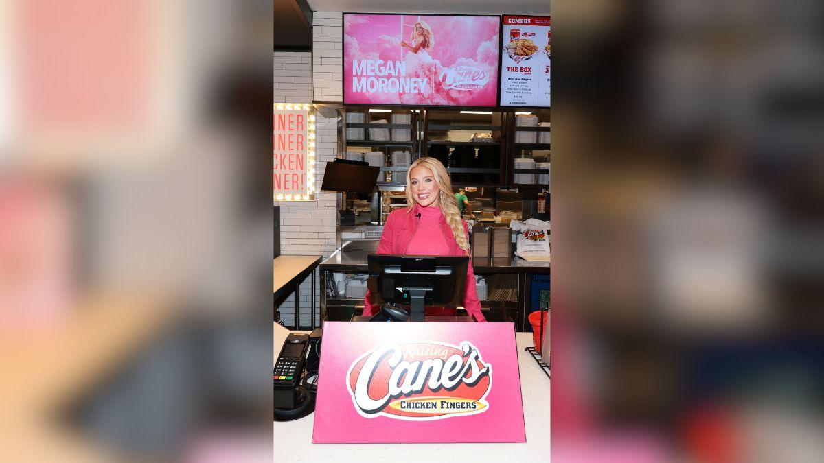 image of During her 'Cloud 9' album listening party at Raising Cane’s Global Flagship in NYC, Megan Moroney surprised fans and stepped behind the front counter to snap selfies and sign autographs.