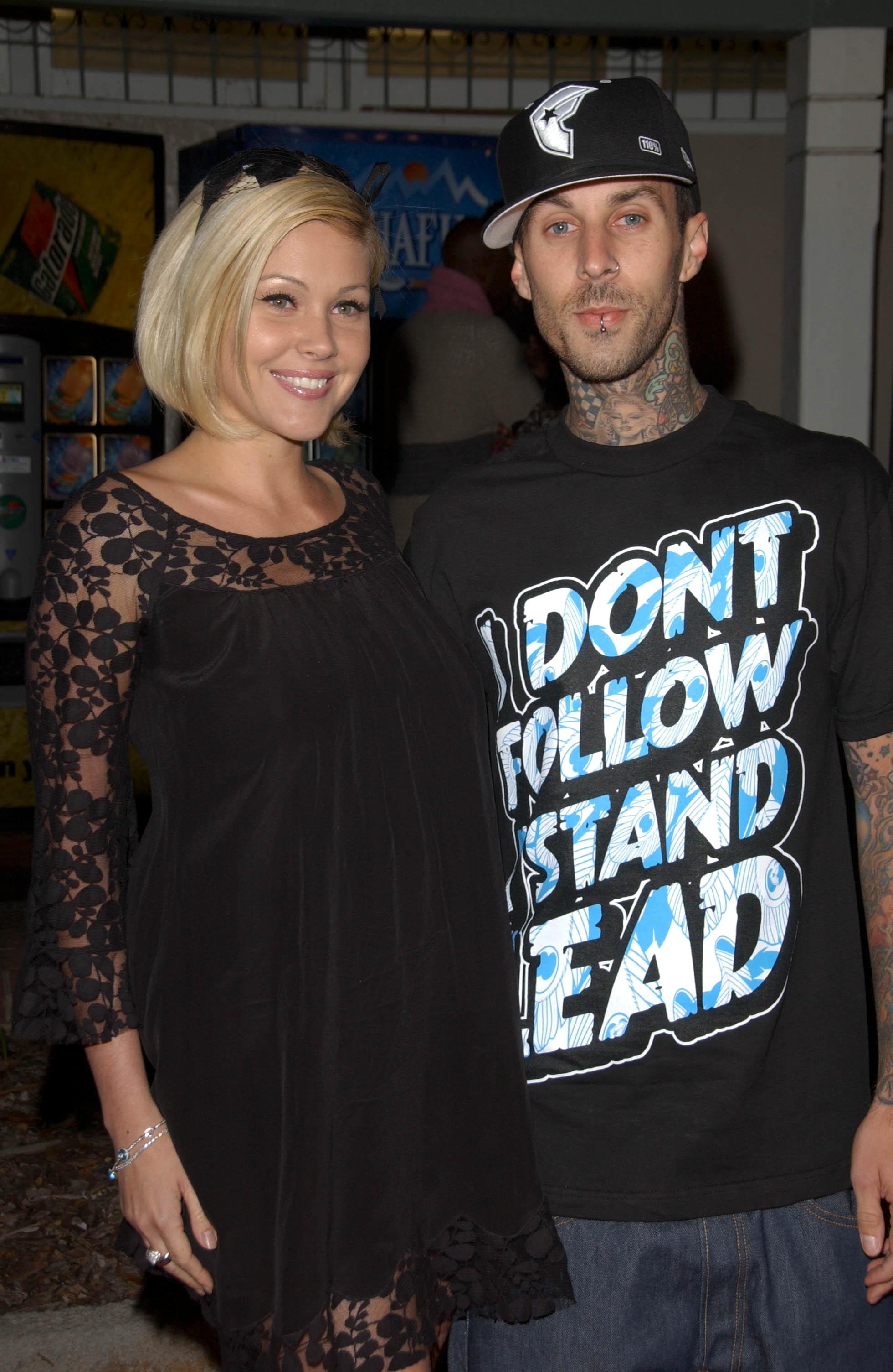 Travis Barker And Shanna Moakler pose for a photo.