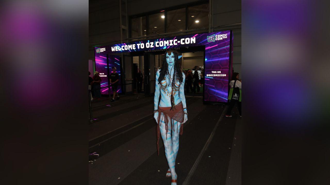 image of Annie Knight completed the look with blue body paint, braids and Na'vi ears.