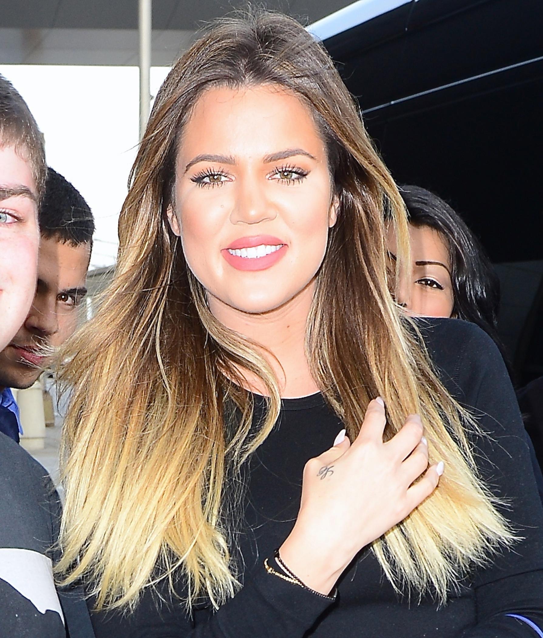 Khloe Kardashian and French Montana sneak a smooch as they fly out of NYC