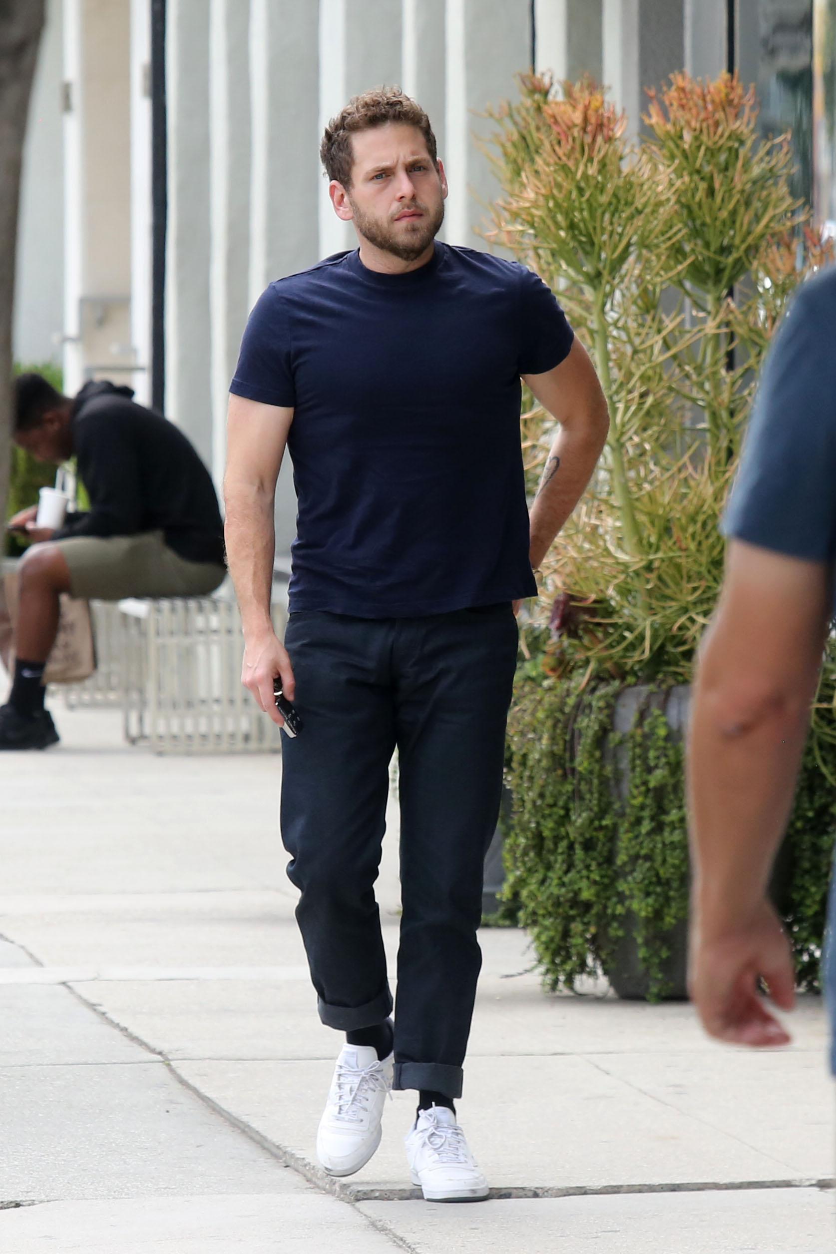 EXCLUSIVE: Jonah Hill shows off his guns in a tight fitted T shirt