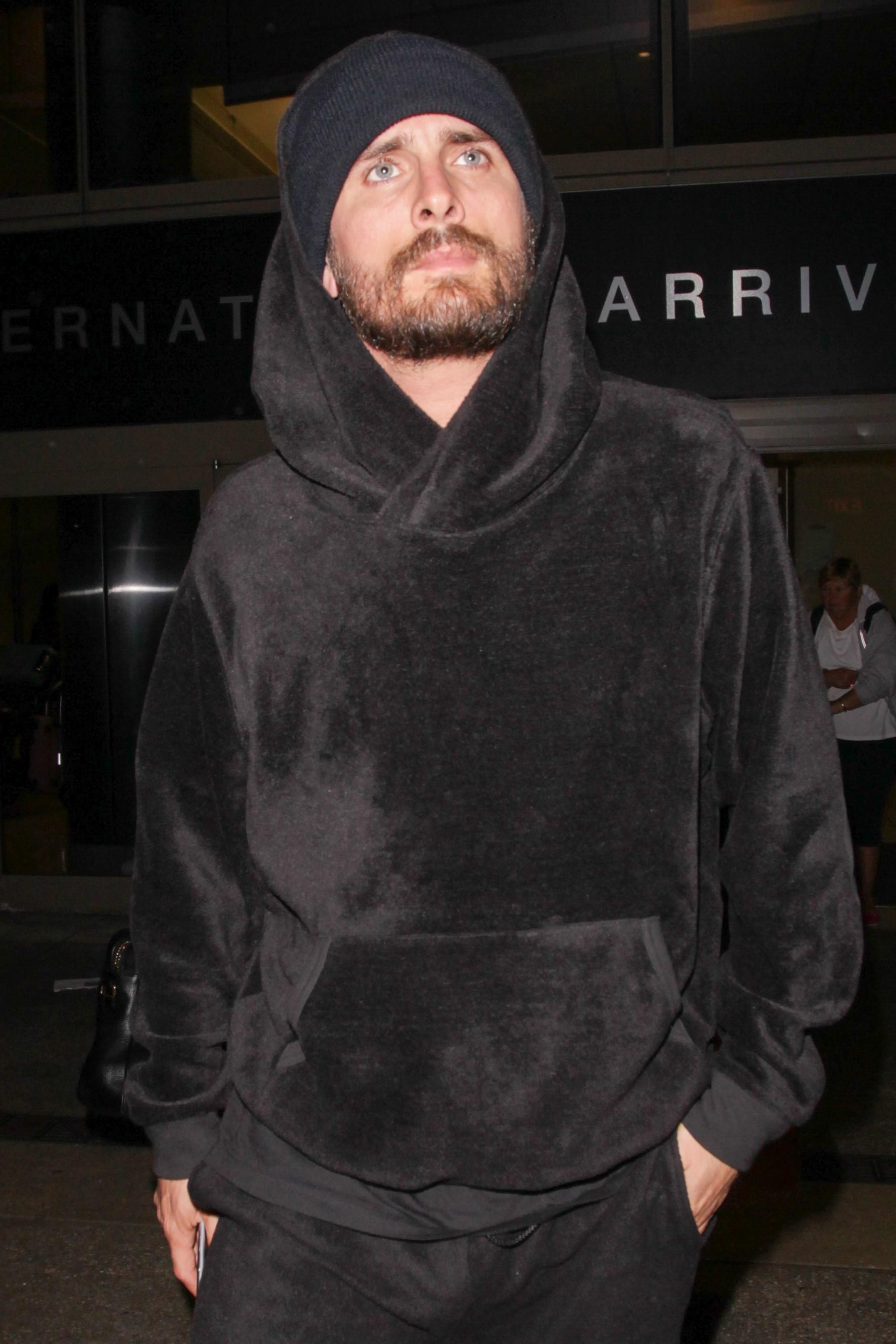 Scott Disick arrives back in LA after a quick trip with Kim to Dubai