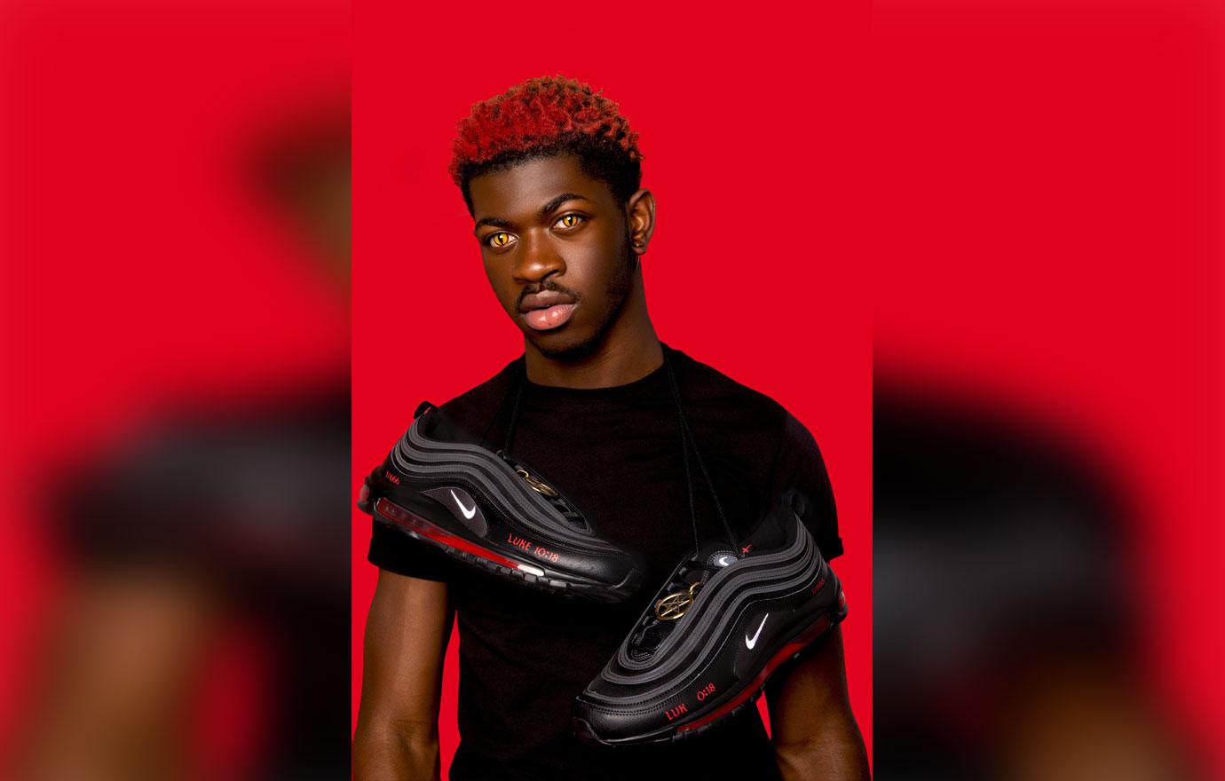 lil nas x poses with his custom satan shoes