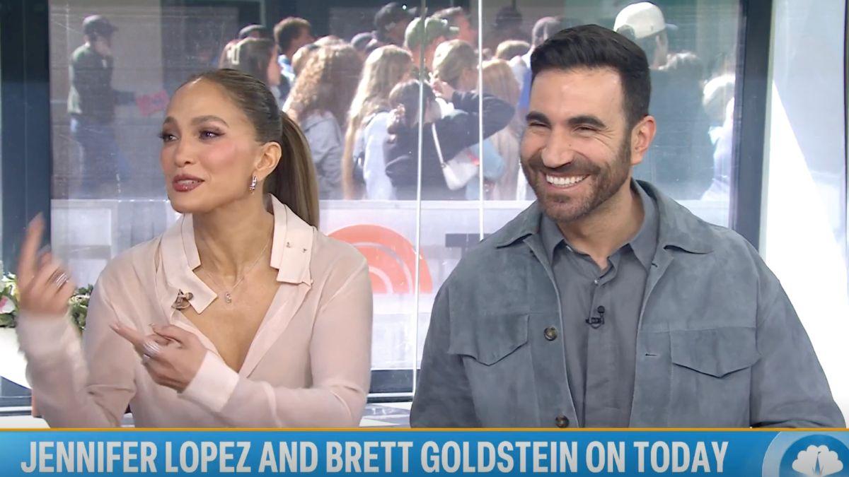Image of Jennifer Lopez claims people try to assume she's dating everyone she spends time with.