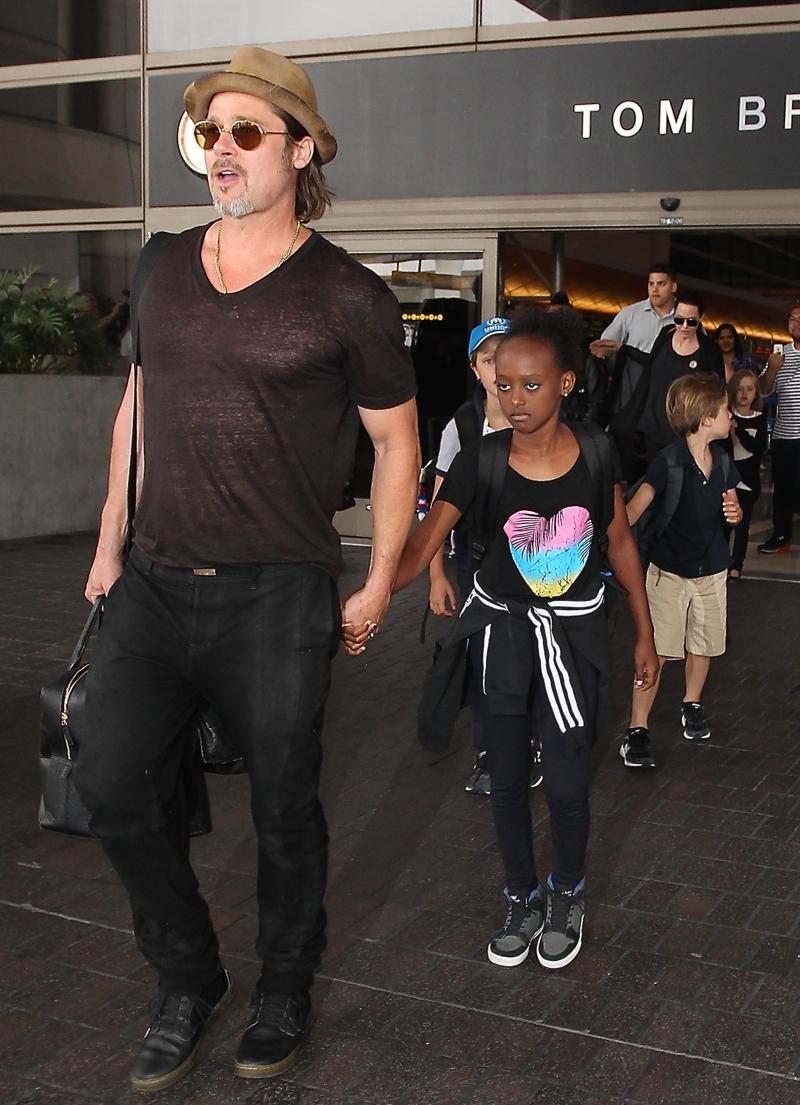 Brad Pitt and Angelina Jolie are seen at LAX