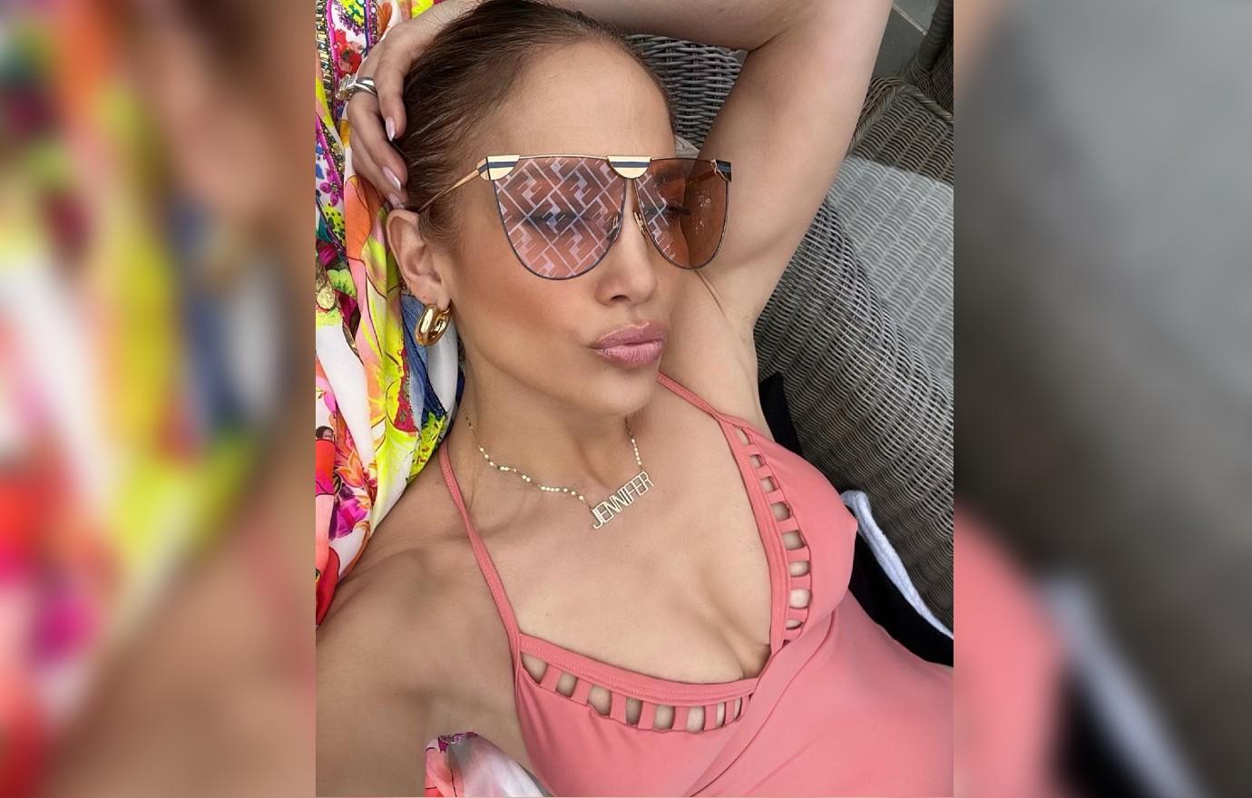 Jennifer Lopez Shows Off Toned Body In Pink Bathing Suit Photos