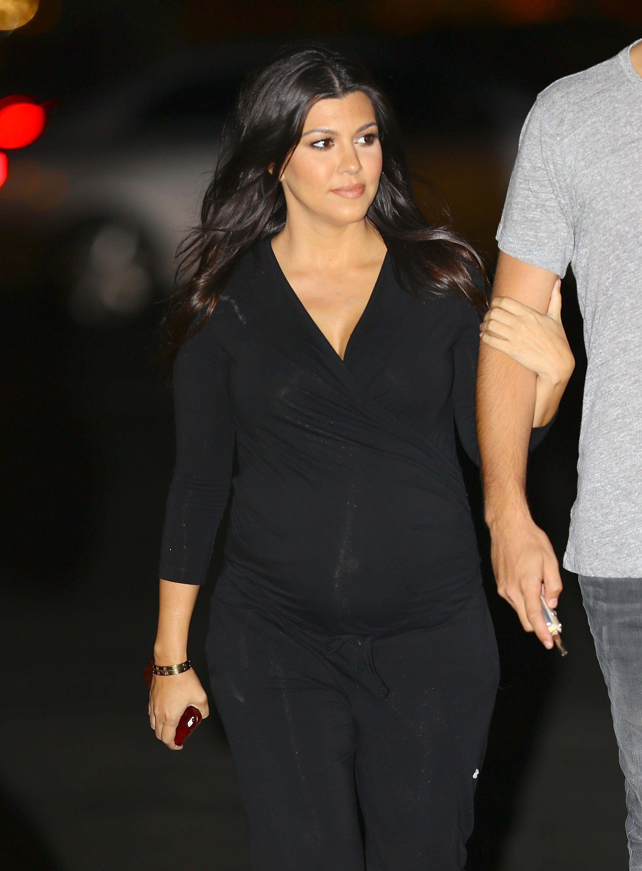 Pregnant Kourtney Kardashian and Scott Disick drive their new Bugatti to dinner