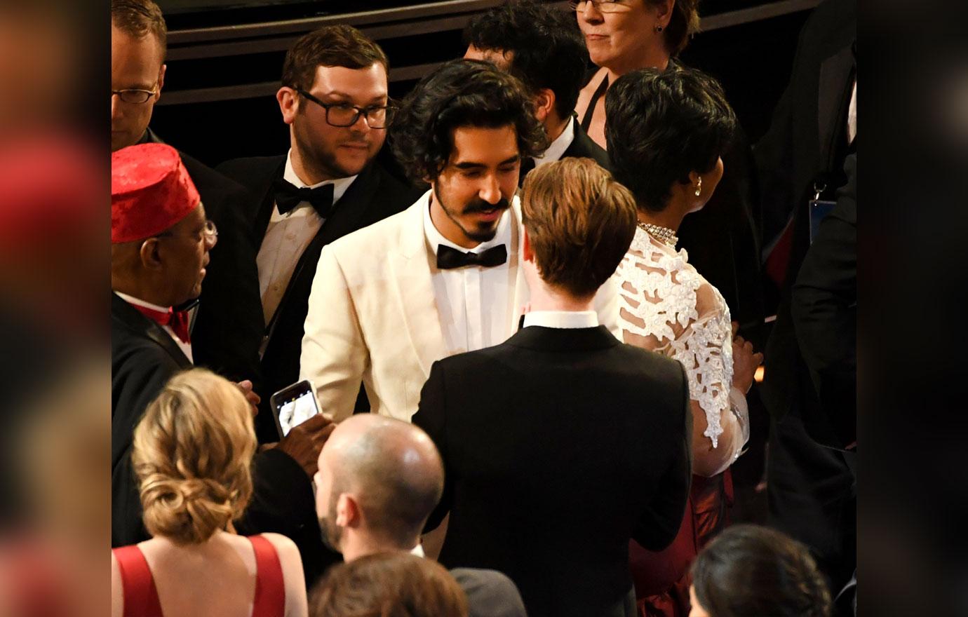 Andrew Garfield Dev Patel Embrace Kiss Oscars 02