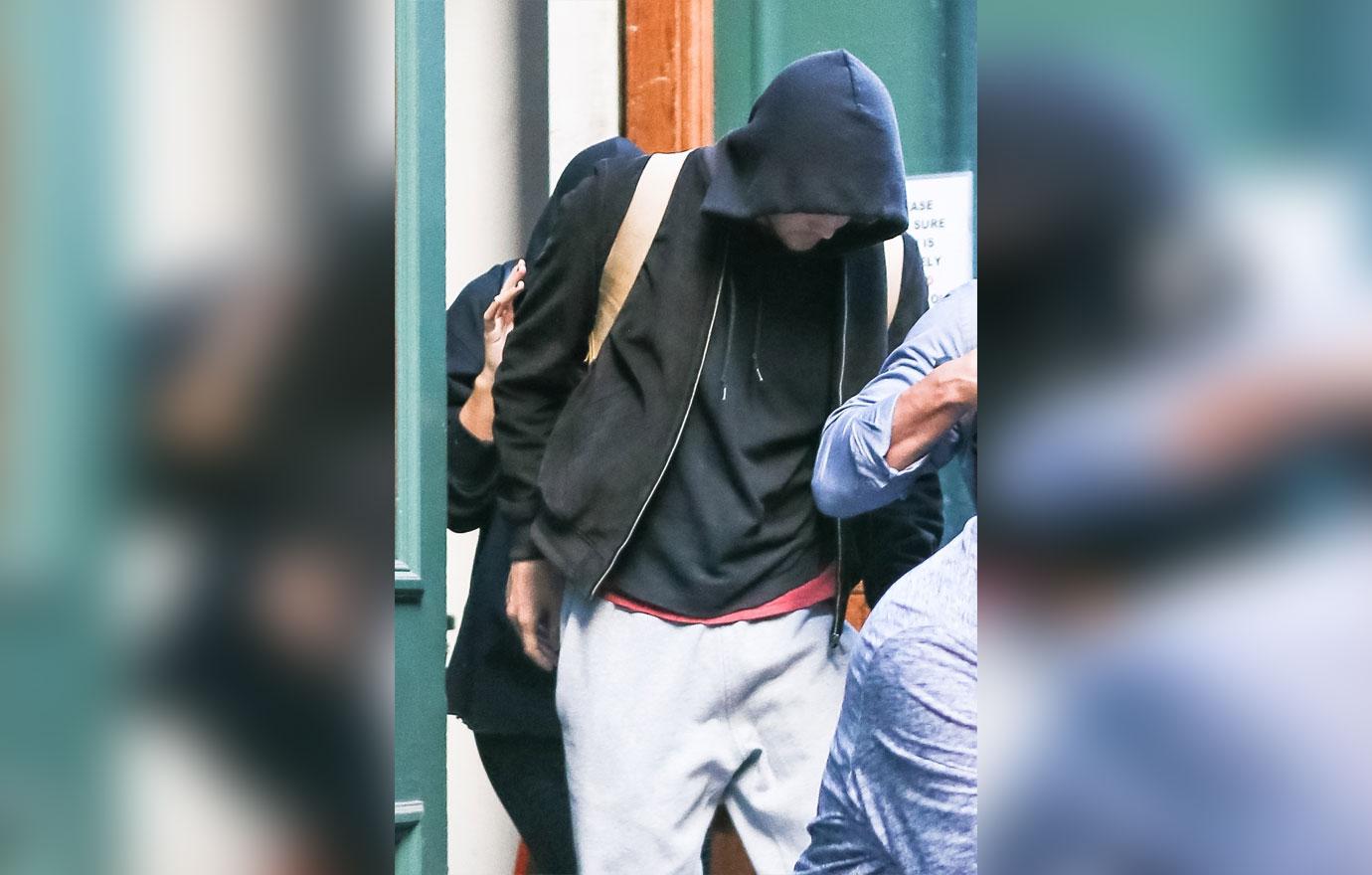 Taylor Swift hides under her hoodie as she steps out with boyfriend Joe Alwyn