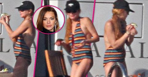 lindsay lohan pregnant baby bump one piece bathing suit