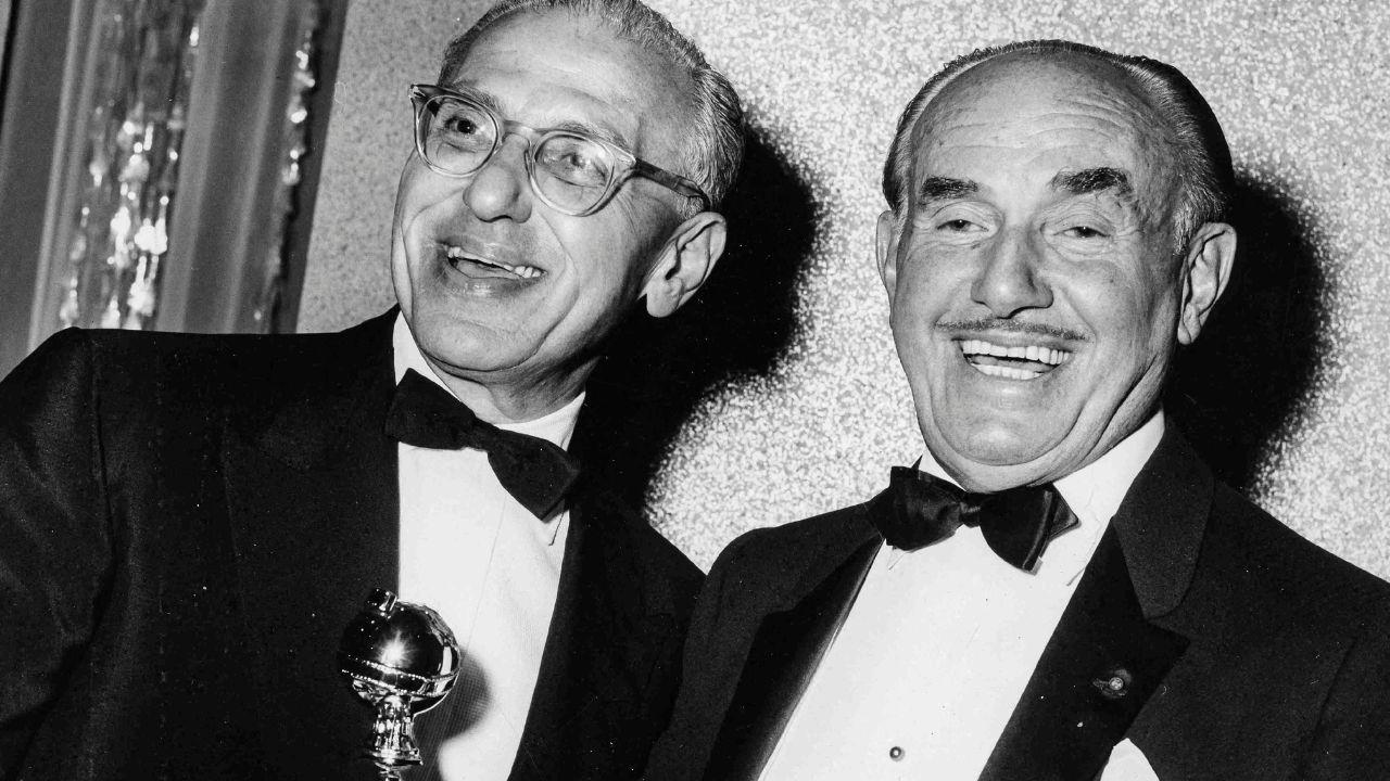 Image of George Cukor and Jack L. Warner.