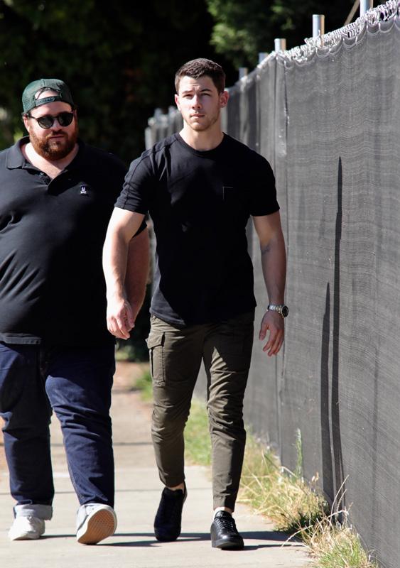 EXCLUSIVE: Nick Jonas looking ripped in a black t shirt