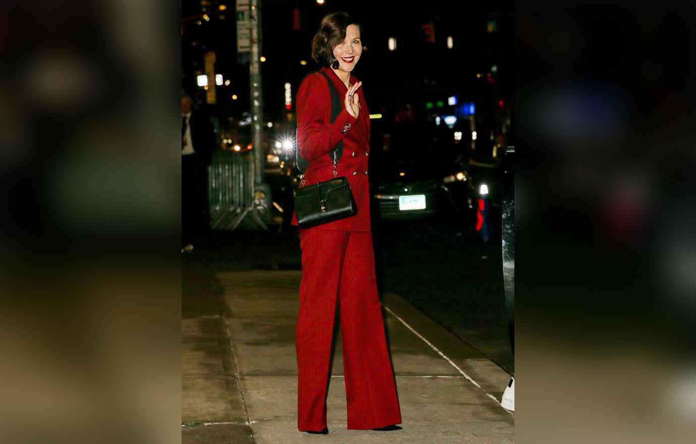 maggie gyllenhaal wears a red suit while leaving the late show with stephen colbert in nyc