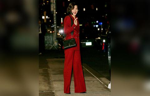 maggie gyllenhaal wears a red suit while leaving the late show with stephen colbert in nyc