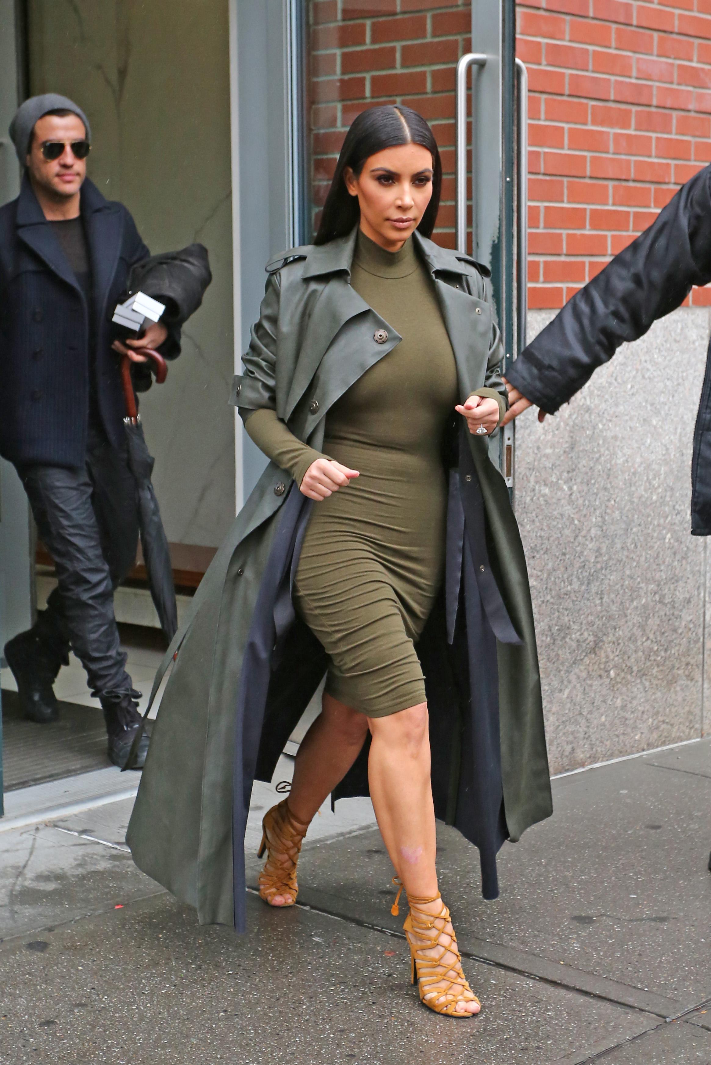 Kim Kardashian steps out of her apartment today in NYC