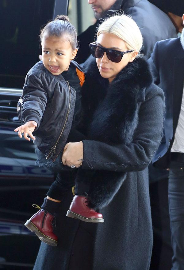 Traveling Tot! North West Pulls Her Frozen Suitcase While Leaving Paris ...