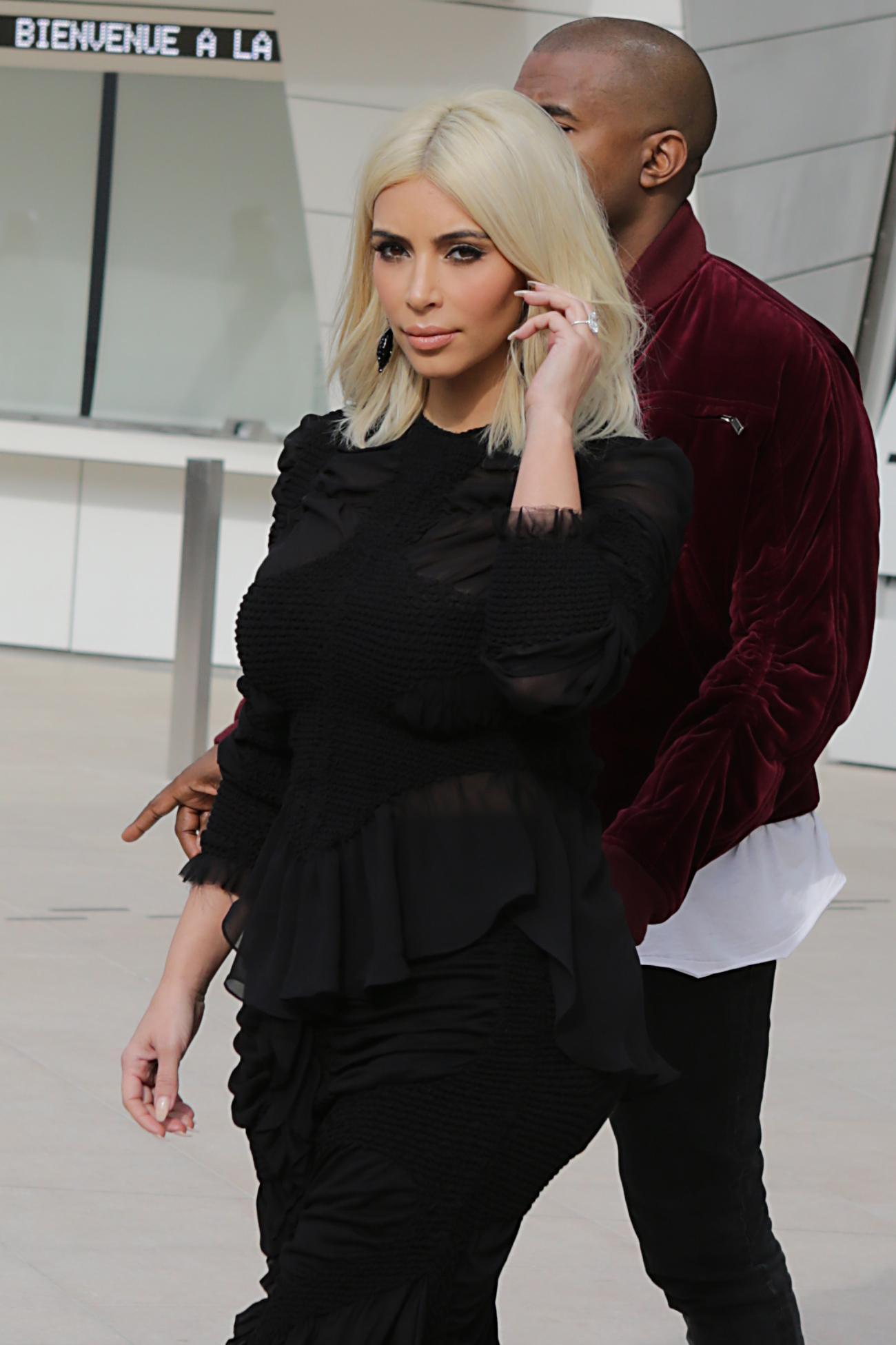 Kim Kardashian &amp; Kanye West leaving Louis Vuitton show FW2015 in Paris