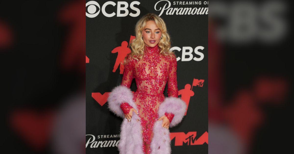 Photo of Sabrina Carpenter added a playful leather boa.