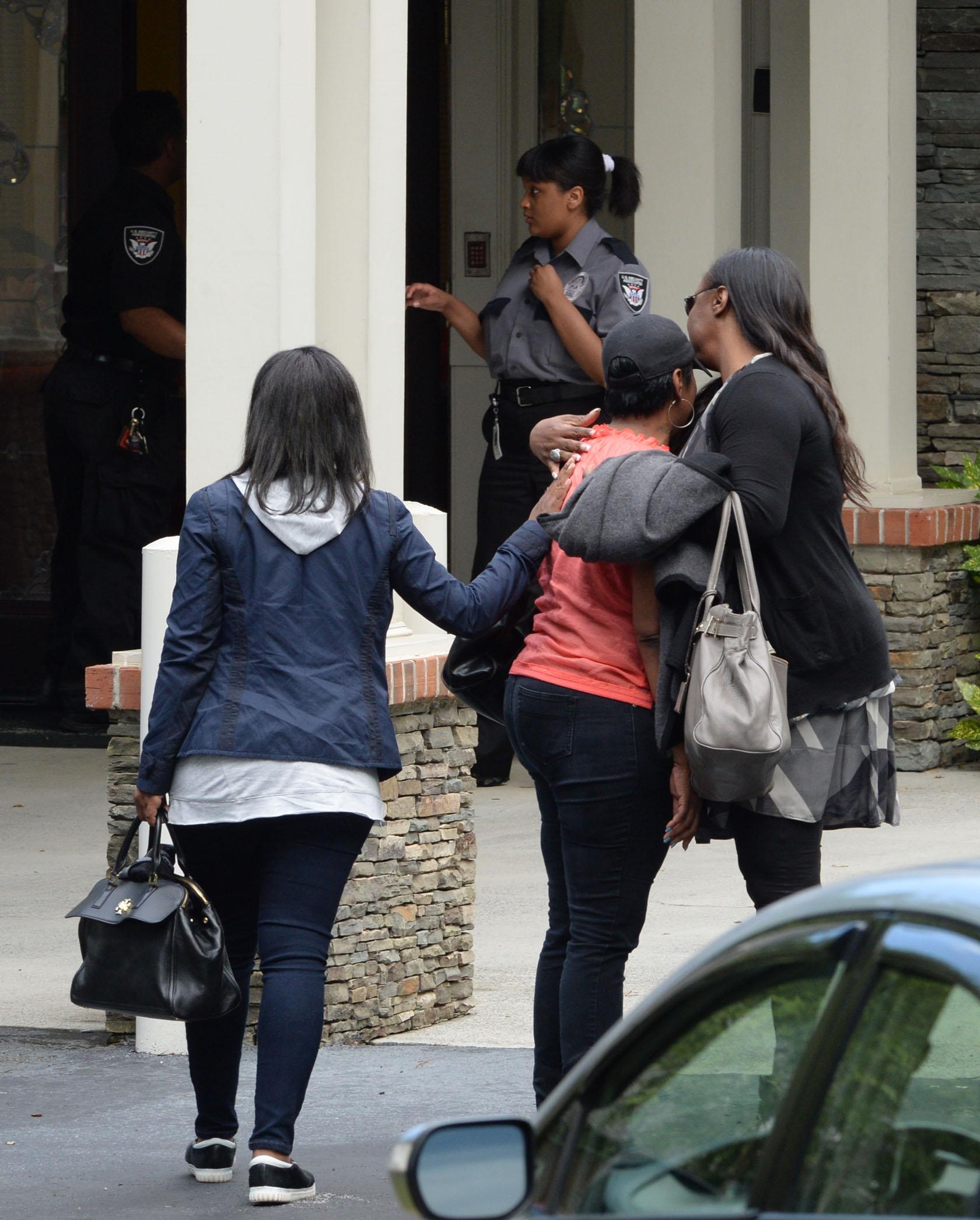 Pat Houston and Tina Brown locked in an emotional embrace outside Bobbi Kristina&#8217;s hospice