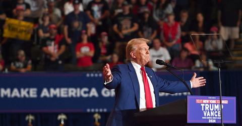 donald trump petting woman side head