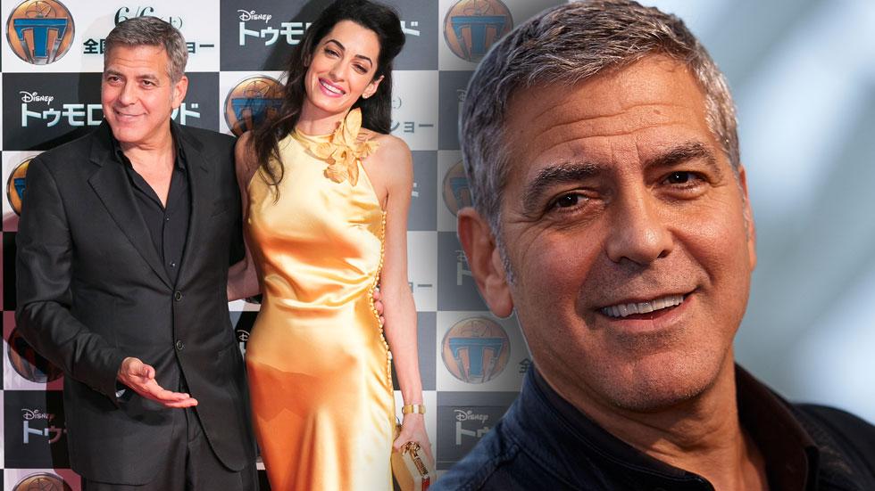 George amal clooney fighting splash getty