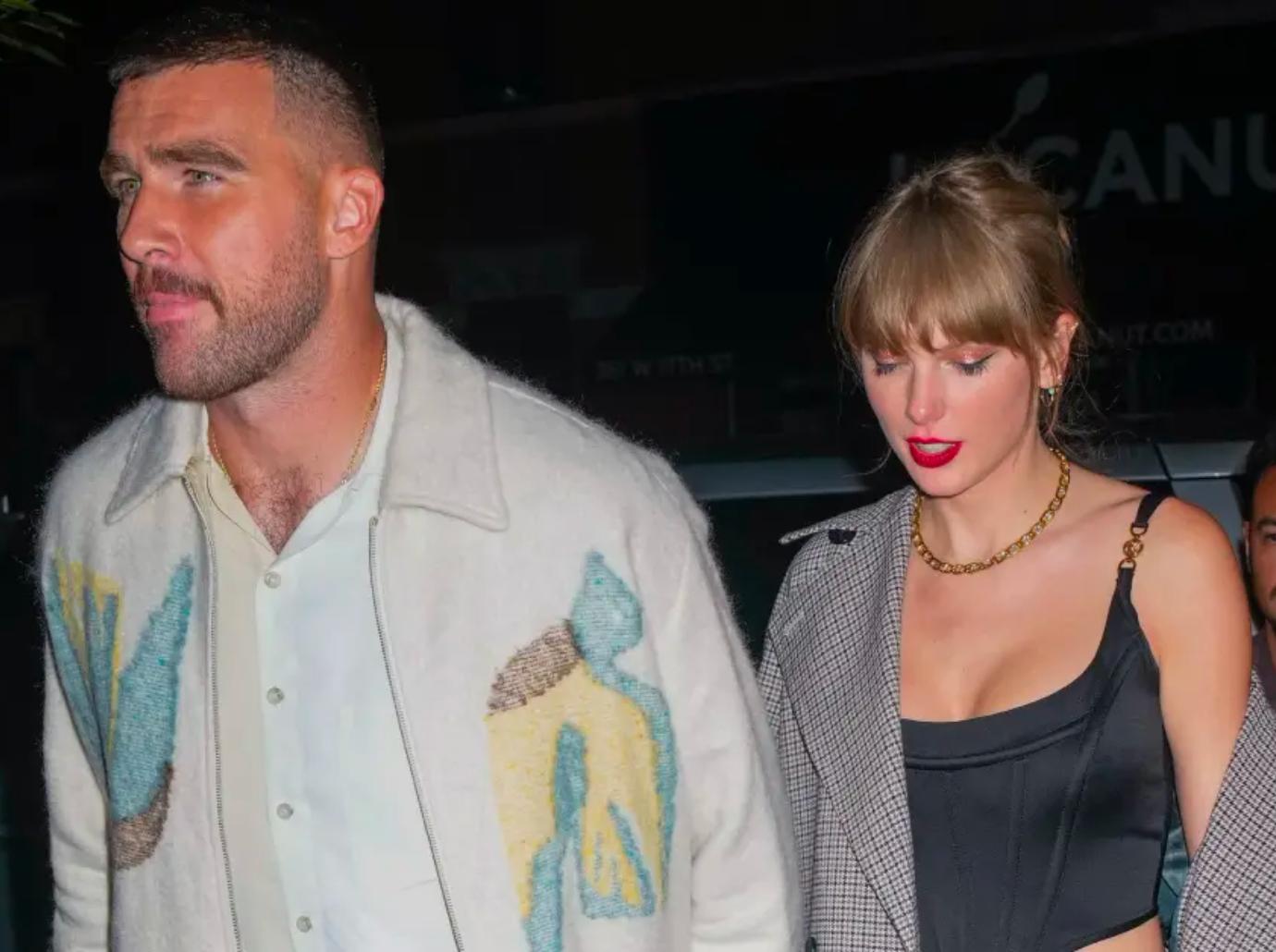 taylor swift travis kelce hold hands leaving chiefs game