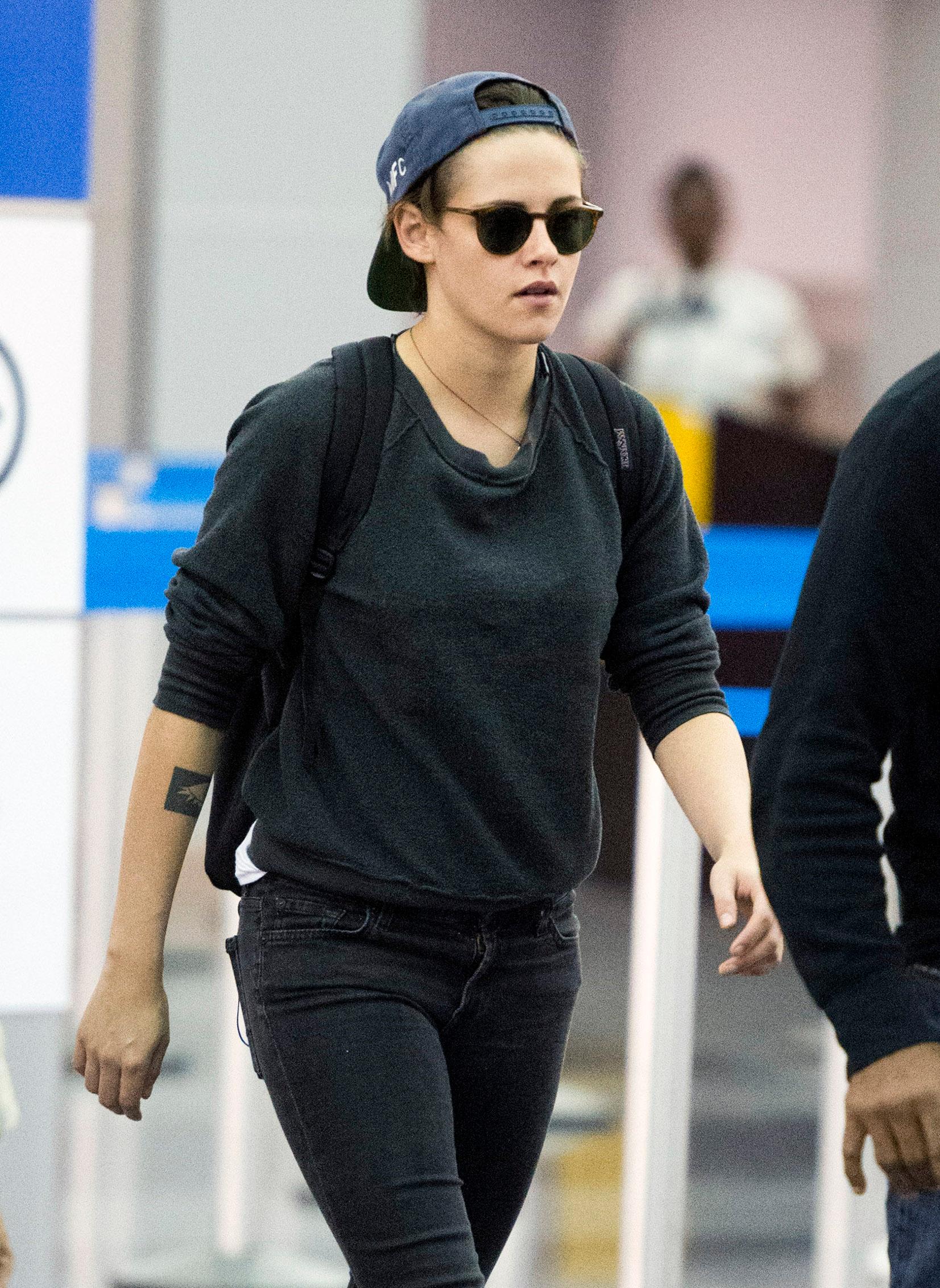 Kristen Stewart walks through JFK airport in NYC