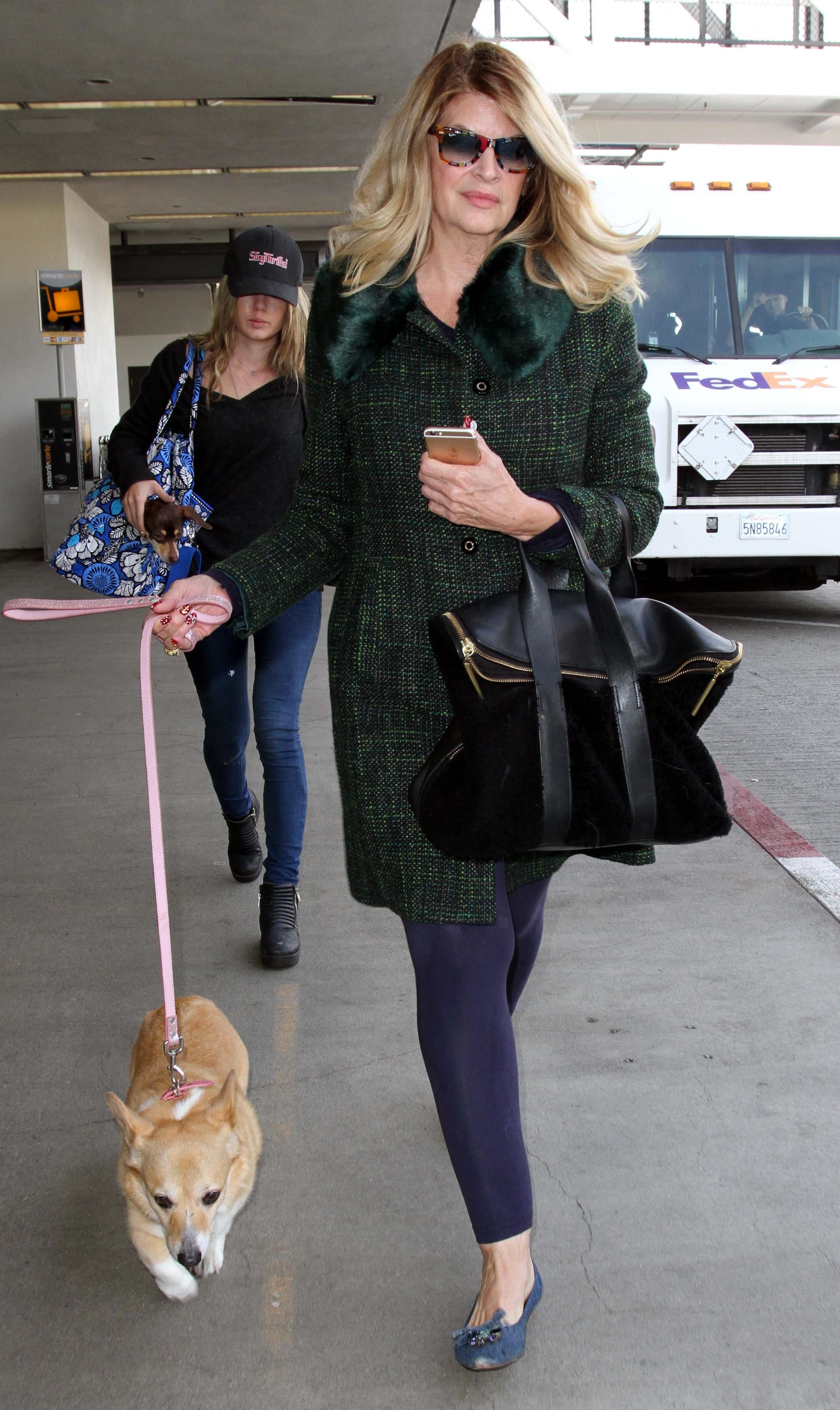 Actress Kirstie Alley is spotted with her dogs as she arrives at LAX Airport in Los Angeles