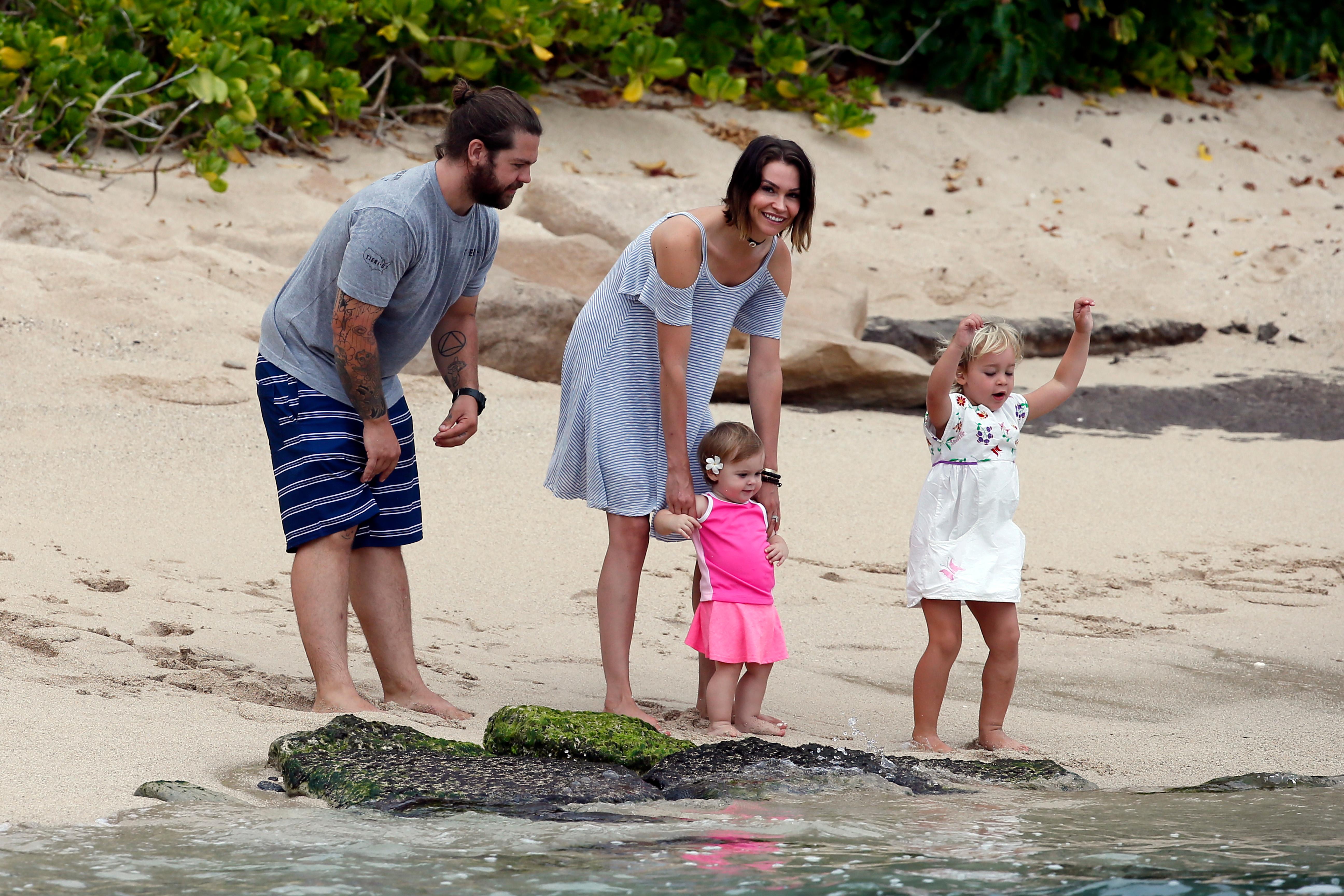 EXCLUSIVE: jack osbourne takes to the beach in Hawaii with his wife Lisa and children Pearl and Andy Rose