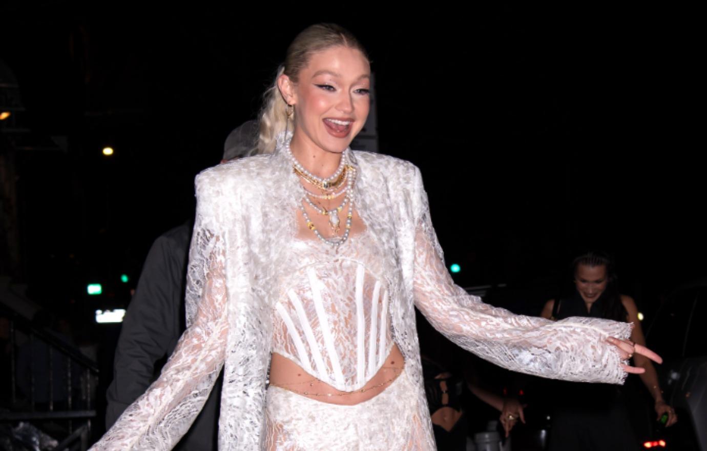 Gigi Hadid flashes confident smile as she leaves NYC party with one of  Leonardo DiCaprio's pals