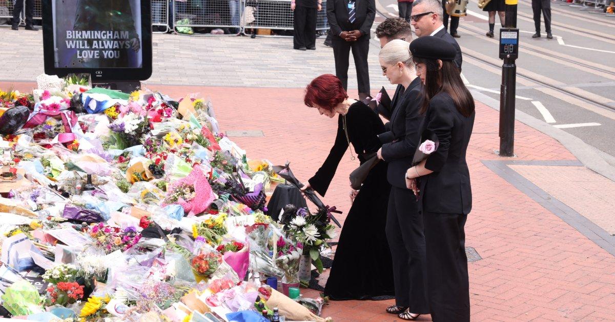 Image of the late musician's loved ones added flowers to the tribute made by fans.