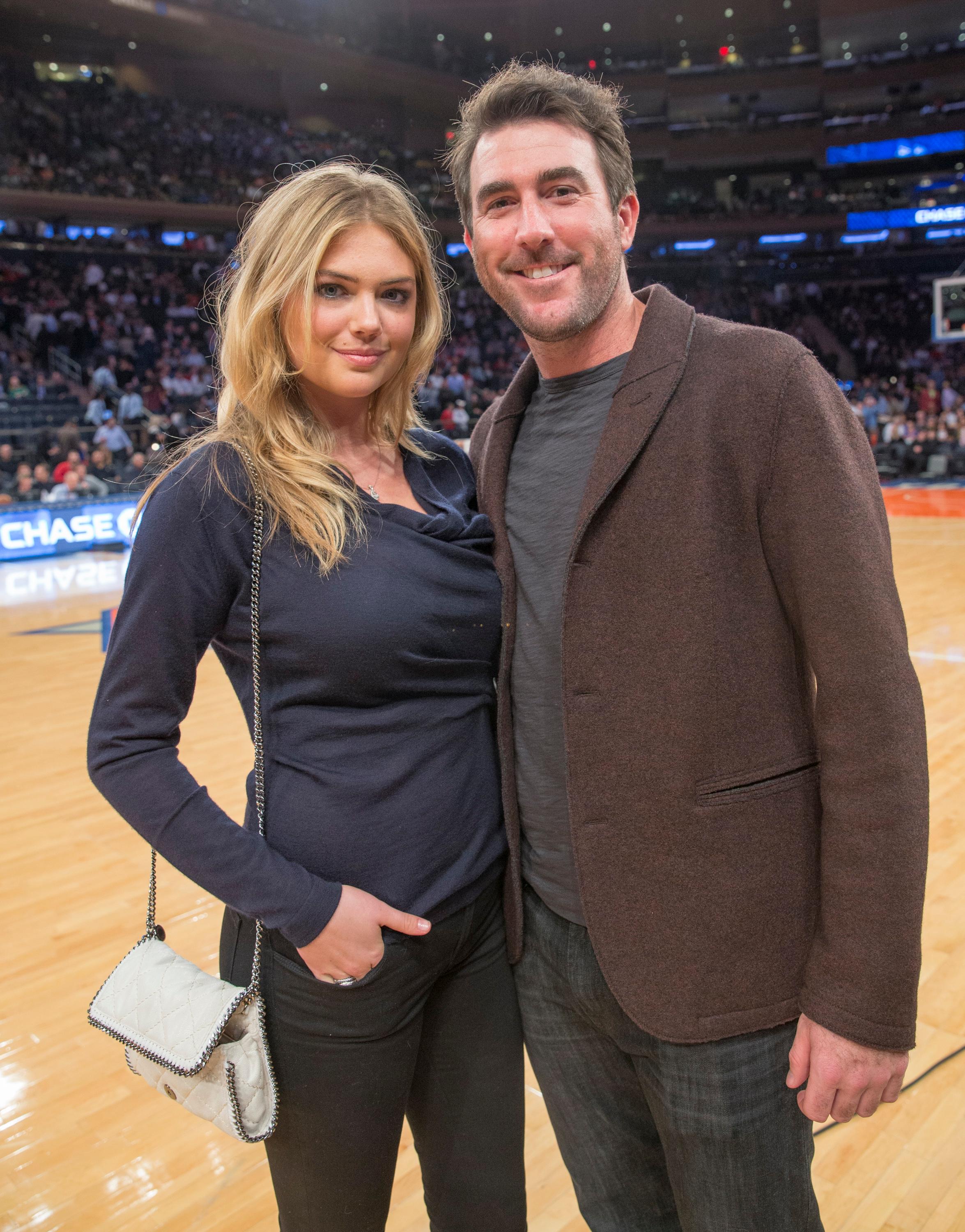 Kate Upton and boyfriend Justin Verlander sit court side at Madison Square Garden as they attend the NY Knicks game