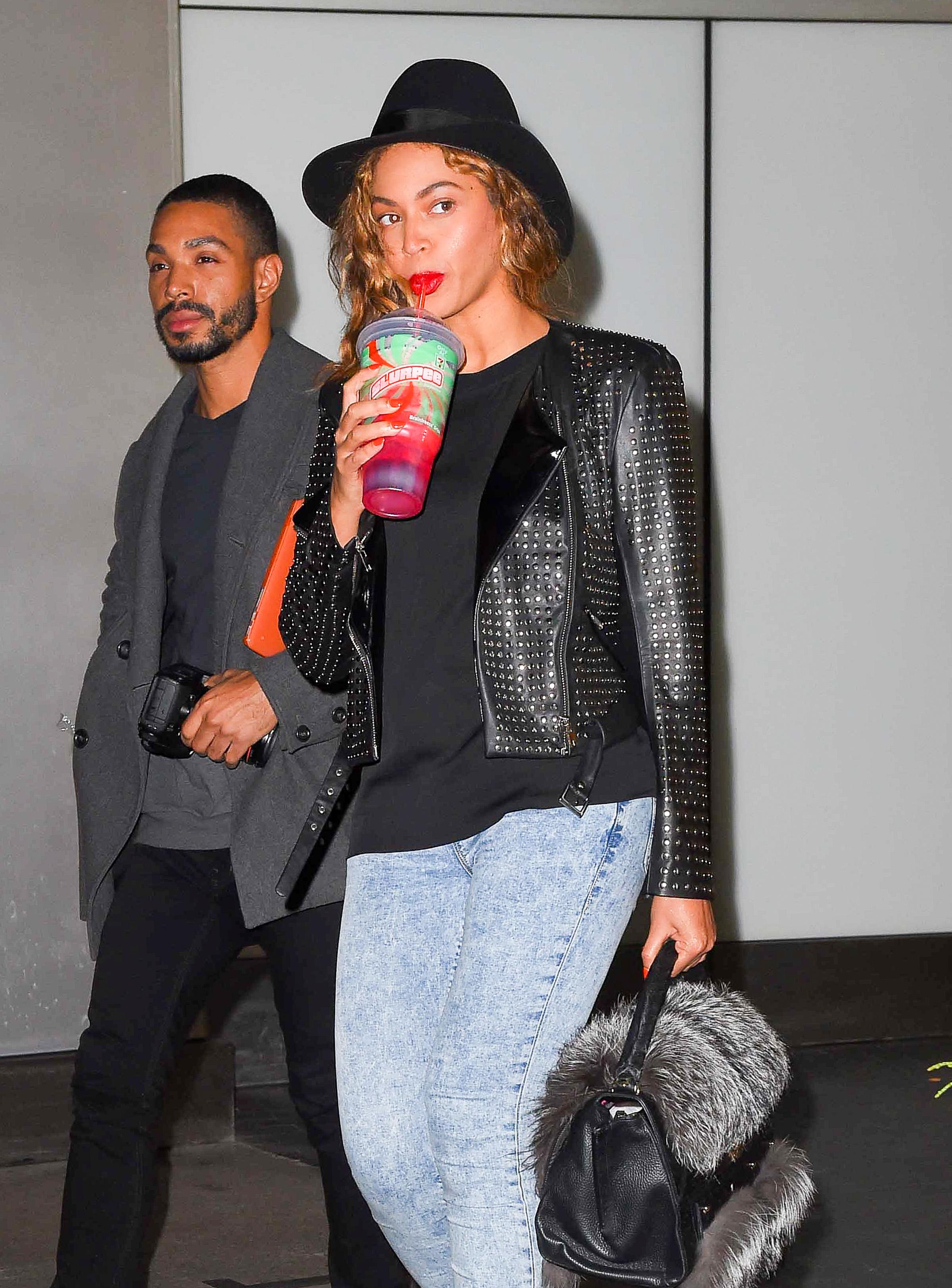 Beyonce sips on her huge sugary slurpee while heading out of her office in New York City