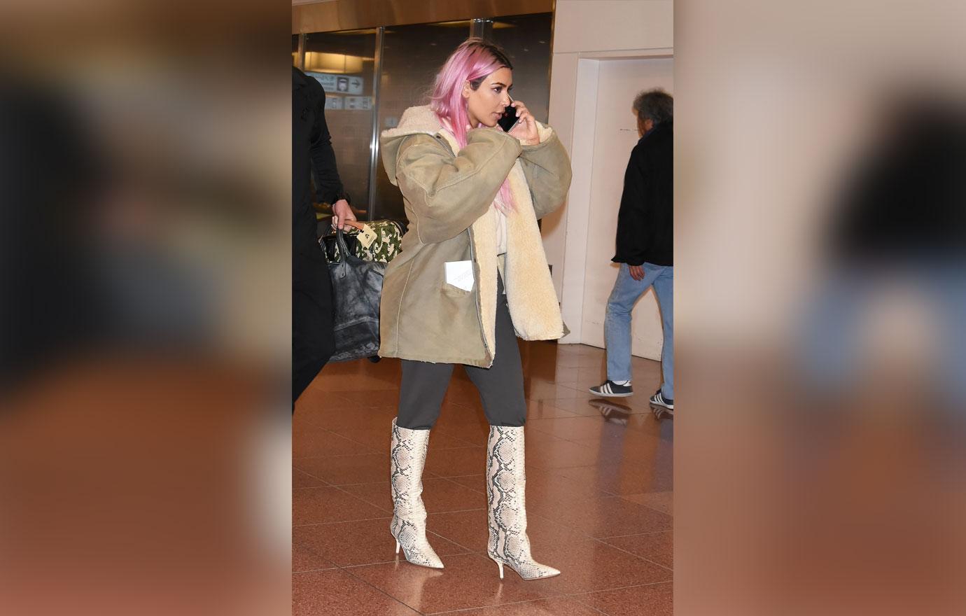 Pink haired Kim Kardashian and sisters Kourtney and Khloe Kardashian land in Tokyo