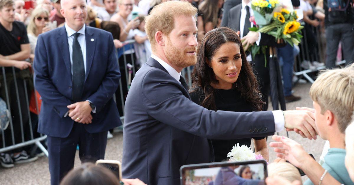 prince harry and meghan markle talking to fans