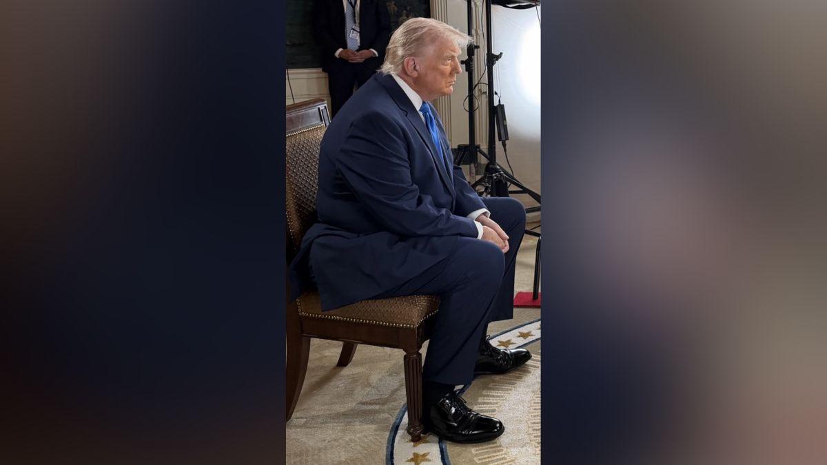 Image of Social media users noticed a 'bulge' protruding from his suit.